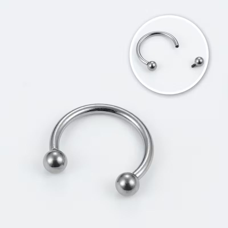 Silver-colored C-shaped circular barbell with two ball ends; inset shows one detached ball and its screw connection
